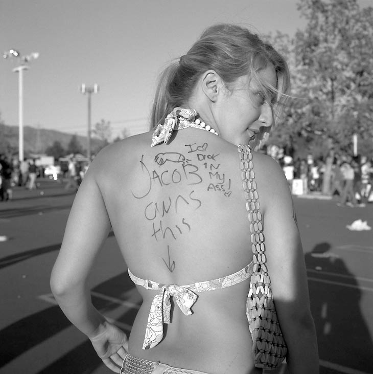 Californian photographer and documentarist Deanna Templeton (born 1969) exhibits her series about the ritual of tattooing and body/clothing signing in the scene of young skate groupies in US under the title 'Scratch My Name on Your Arm'. Deanna has chosen the title from a song by the Smiths with the lyrics “Scratch my name on your arm with a fountain pen / This means you really love me”, because her series contain a very romantic side about love too. 