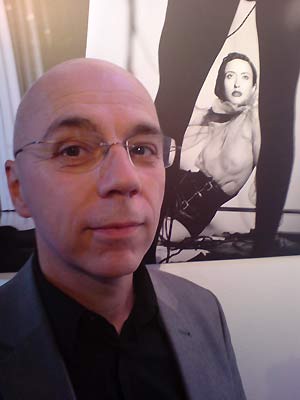 fig.: Peter Legat, guitarist, composer, mastermind of the Austrian Jazz formation Count Basic, in front of an image by Tina Herzl Vienna/New York. Watch the Count Basic-video 'No Visible Scars' with vocalist Kelli Sae, 4 Nov 2009. 