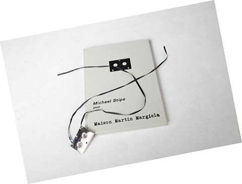 fig.: Michael Stipe pour Maison Martin Margiela ' 925 sterling silver microcassette' in a handmade notebook; limited to 199 pieces.